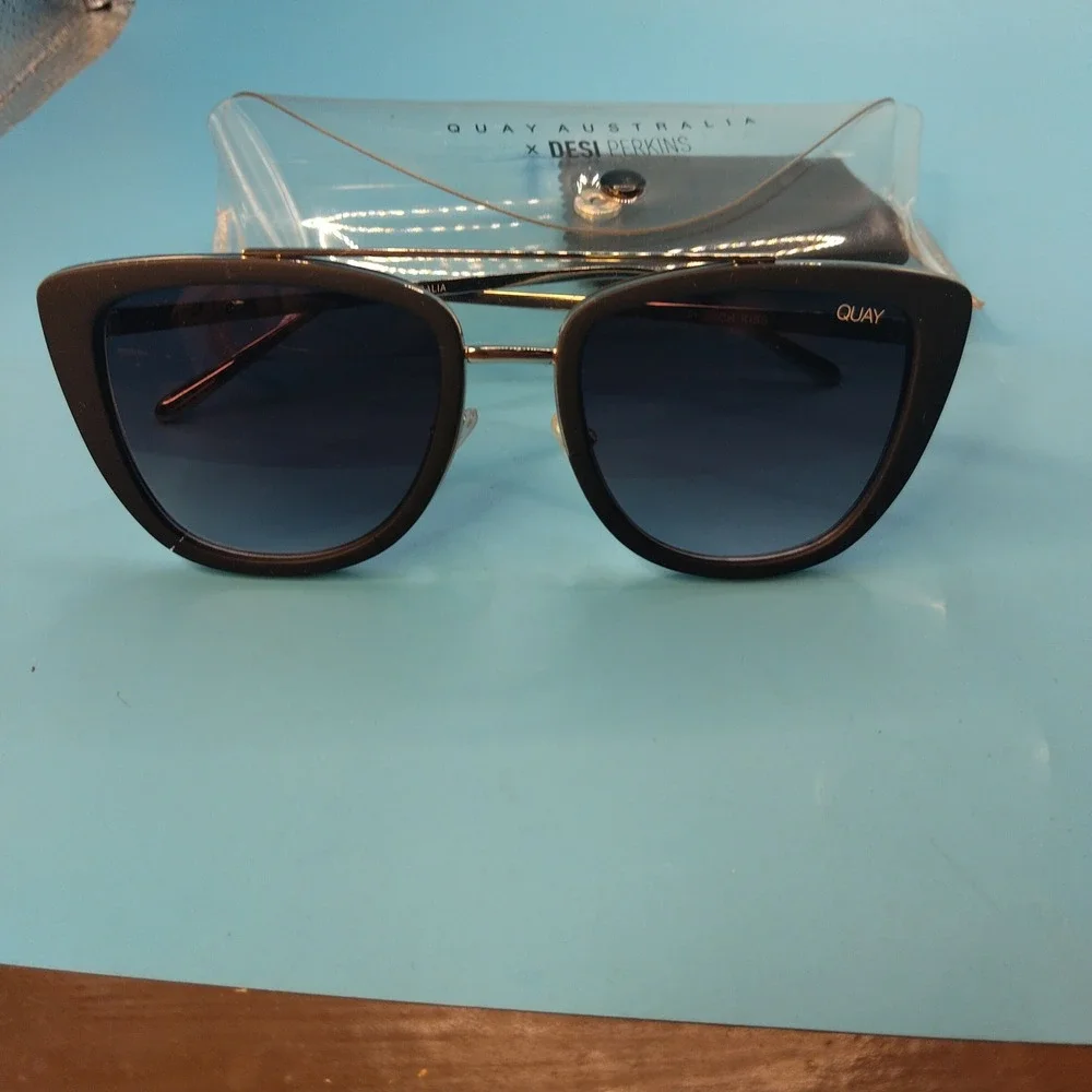 Quay Australia x Desi Perkins French Kiss Sunglasses Black Gold Cat Eye Flat Les